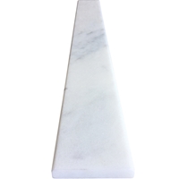 Close-up view of 6 x 58 Saddle Threshold White Marble Stone shows the top surface finish and bevel on both long edges